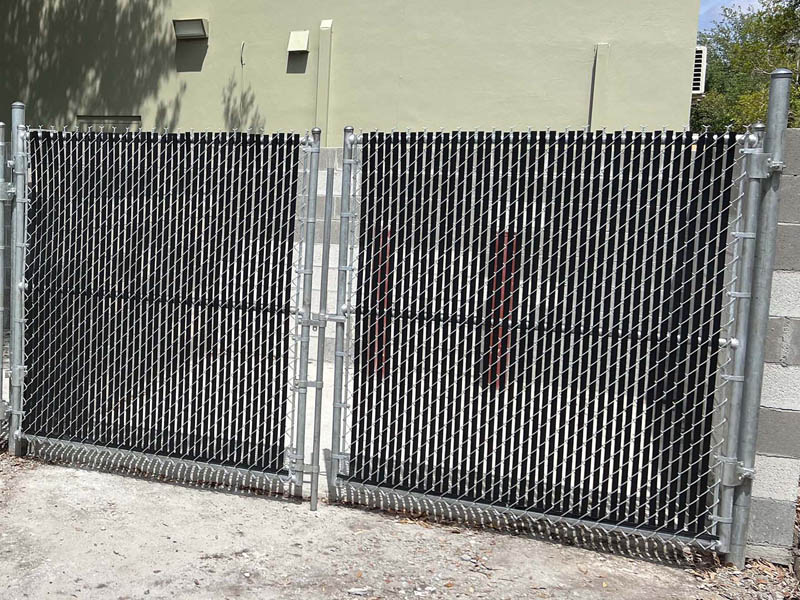 Chain Link fence with semi-privacy slats installation company in Tampa Florida
